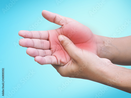 Asian adults with hand pain Peripheral neuropathy Massage on palm to relieve pain. © kittima