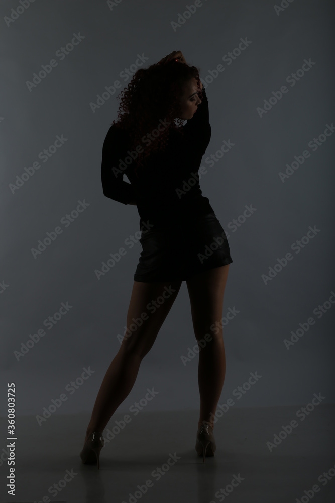 silhouette of a slender girl in the twilight silhouette of a slender girl in the twilight