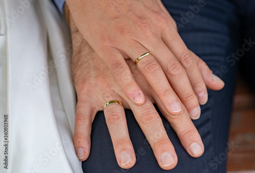 hands of the groom and the bride