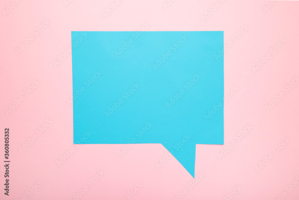 Blue paper speech bubbles on pink background Blue paper speech bubbles on pink background
