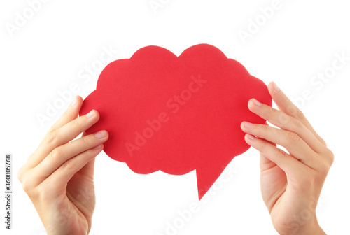 Hand holding an red empty speech bubble isolated on white background