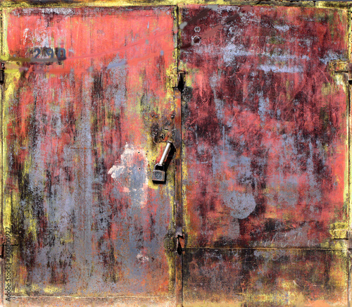 Metal garage doors painted by people as an abstract painting photo