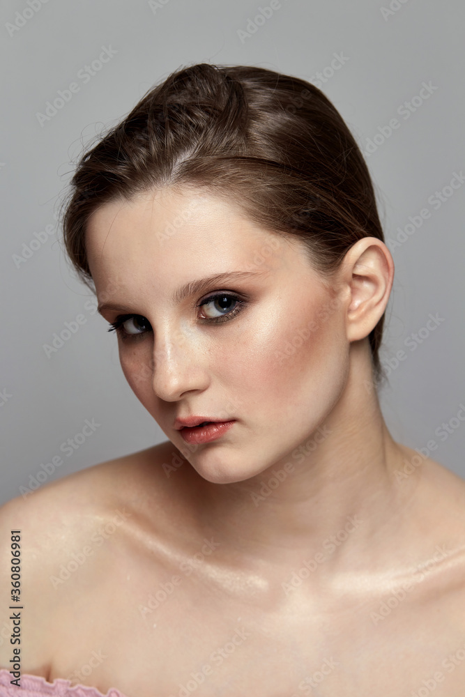 Beautiful bright make-up in a young brunette girl. Face close-up. Beautiful bright make-up in a young brunette girl. Face close-up.