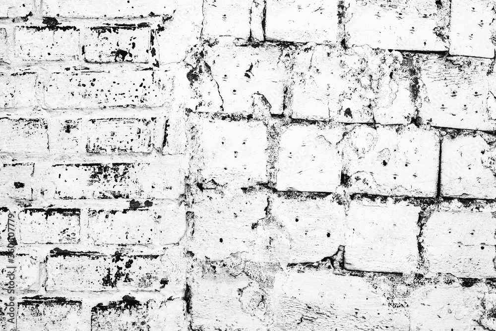 Texture of a brick wall with cracks and scratches which can be used as a background Texture of a brick wall with cracks and scratches which can be used as a background