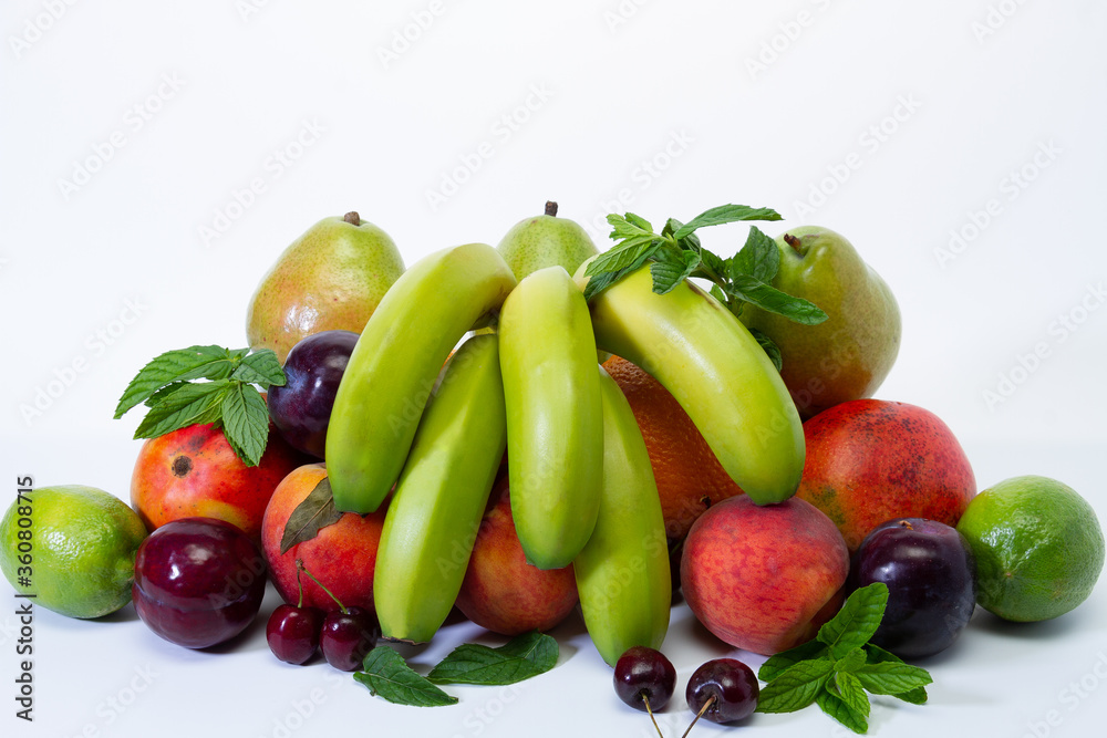 Assortment of exotic fruits on a white background. The concept of a healthy lifestyle.