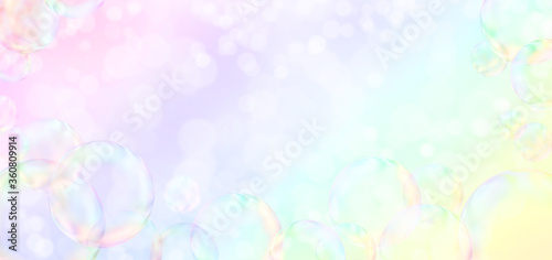 Soap bubbles on rainbow colors background