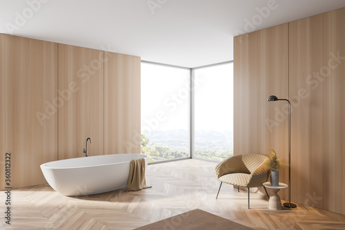 Wooden bathroom corner with tub and armchair