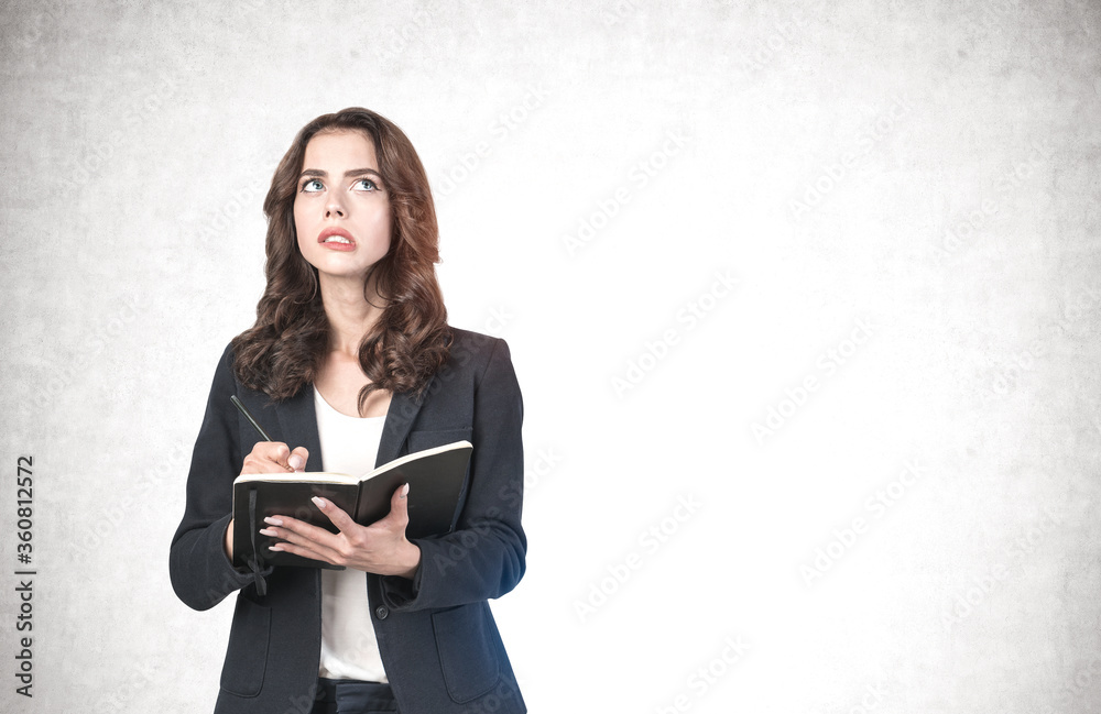 Troubled businesswoman with notebook, mock up Troubled businesswoman with notebook, mock up