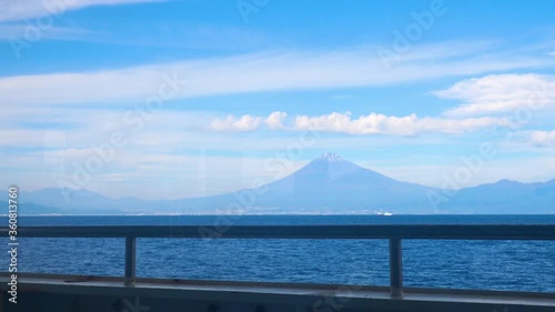 Fuji mountain view with sea and blue sky through window from the Suruga Bay Ferry at Shimizu port, Shizuoka, Japan (Some reflect from window)