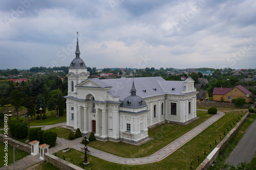 Very beautiful Catholic church in a small village. aerial photography. © Ирина Варкулевич