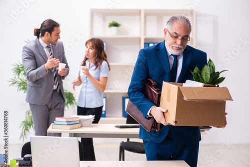 Two male and one female employees working in the office