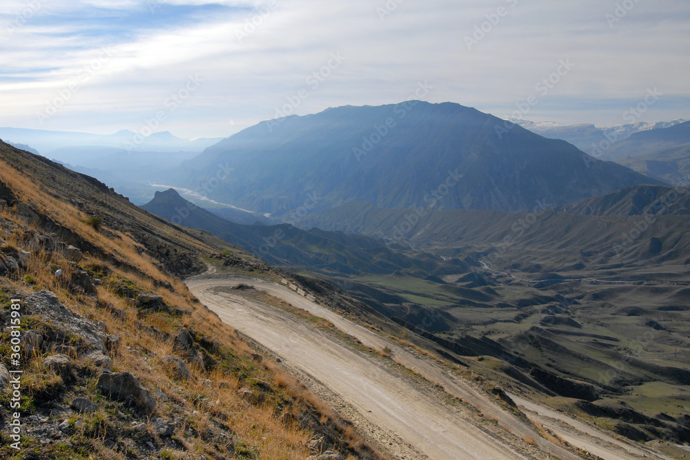 Fototapeta premium Mountainous landscape with hairpin turn. View at the road between Botlikh and Andi villages. Dagestan, North Caucasus, Russia.