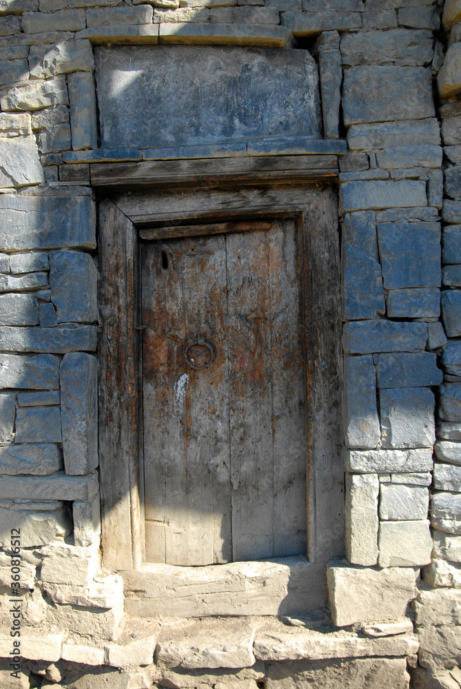 Old traditional wooden door. Hushtada village, Dagestan, North Caucasus, Russia. Old traditional wooden door. Hushtada village, Dagestan, North Caucasus, Russia.