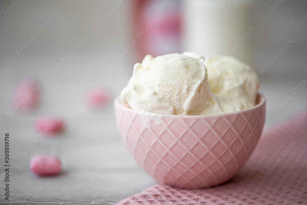 three scoops of white cream ice cream in a pink bowl three scoops of white cream ice cream in a pink bowl