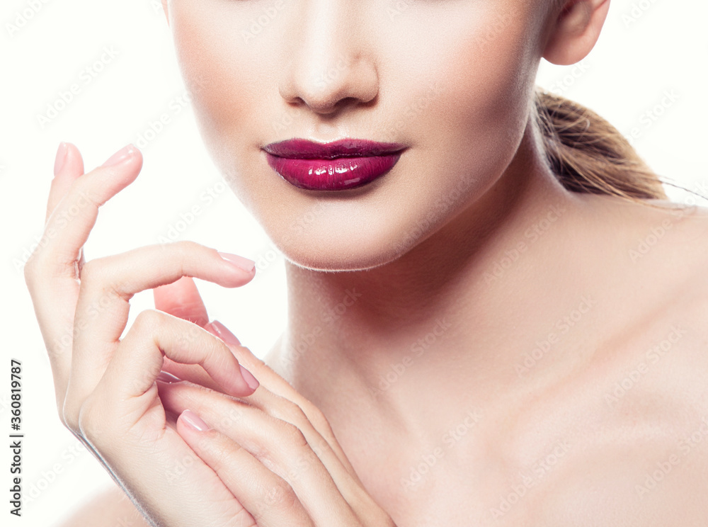 Beauty part of face of young woman with finger hand near lips
