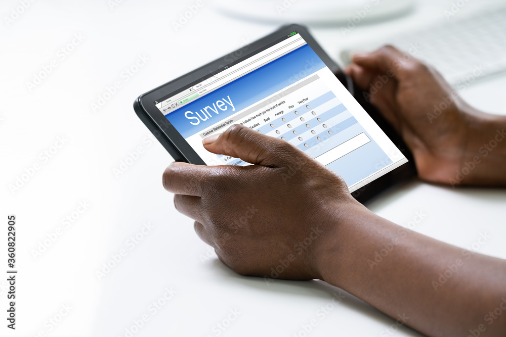 African Woman Filling Survey Poll Or Form African Woman Filling Survey Poll Or Form
