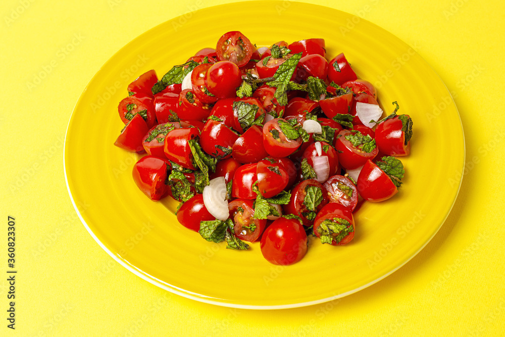 Homemade cherry tomato salad with fresh onions, mint, olive oil and salt Homemade cherry tomato salad with fresh onions, mint, olive oil and salt