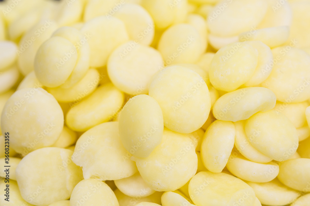 close-up of yellow cocoa butter pieces - theobroma oil close-up of yellow cocoa butter pieces - theobroma oil