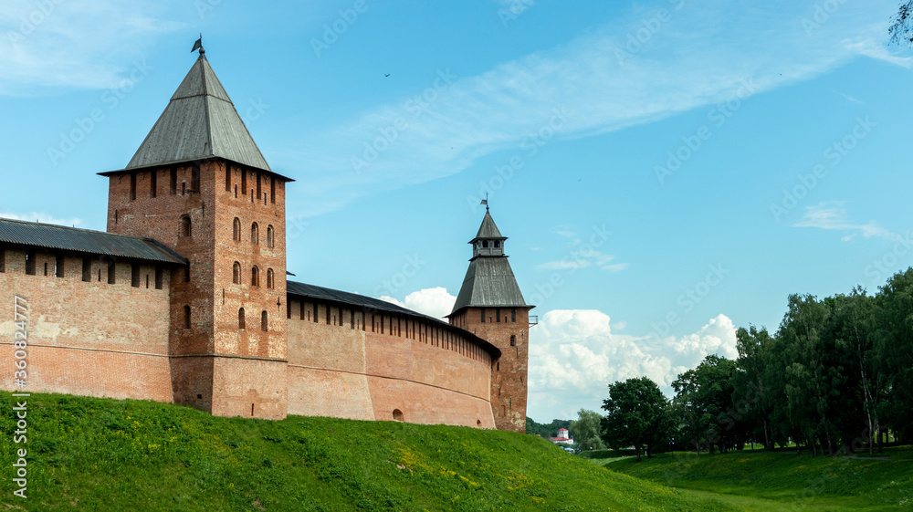high brick wall of the fortress with towers