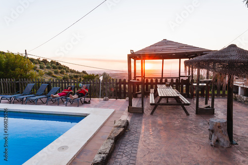 Exterior terrace of a rural rental house with pool in Spain. © Manuel