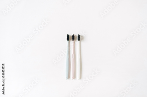 Toothbrushes on white background. Flat lay  top view oral care  dental hygiene concept.