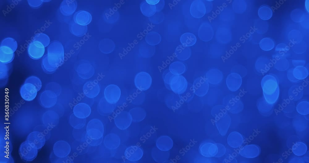 Beautiful reflection of defocused lights in the water. Defocused abstract blue christmas background. Beautiful reflection of defocused lights in the water. Defocused abstract blue christmas background.