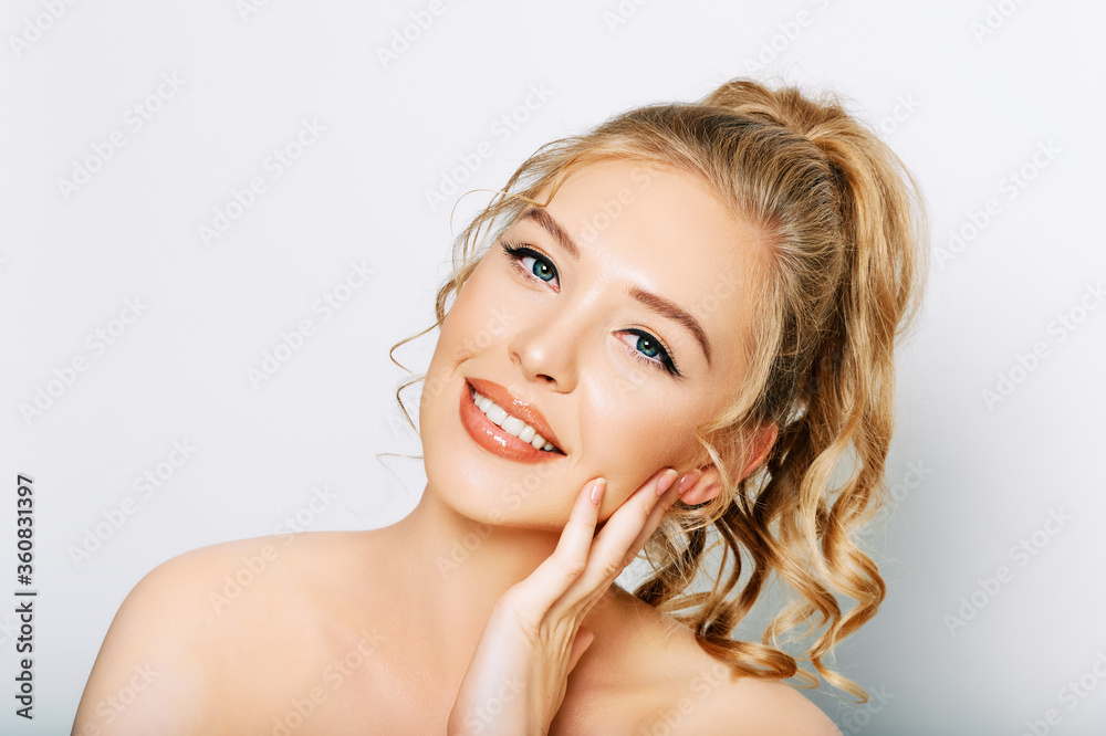 Close up portrait of beautiful young woman on white background, touching soft skin Close up portrait of beautiful young woman on white background, touching soft skin