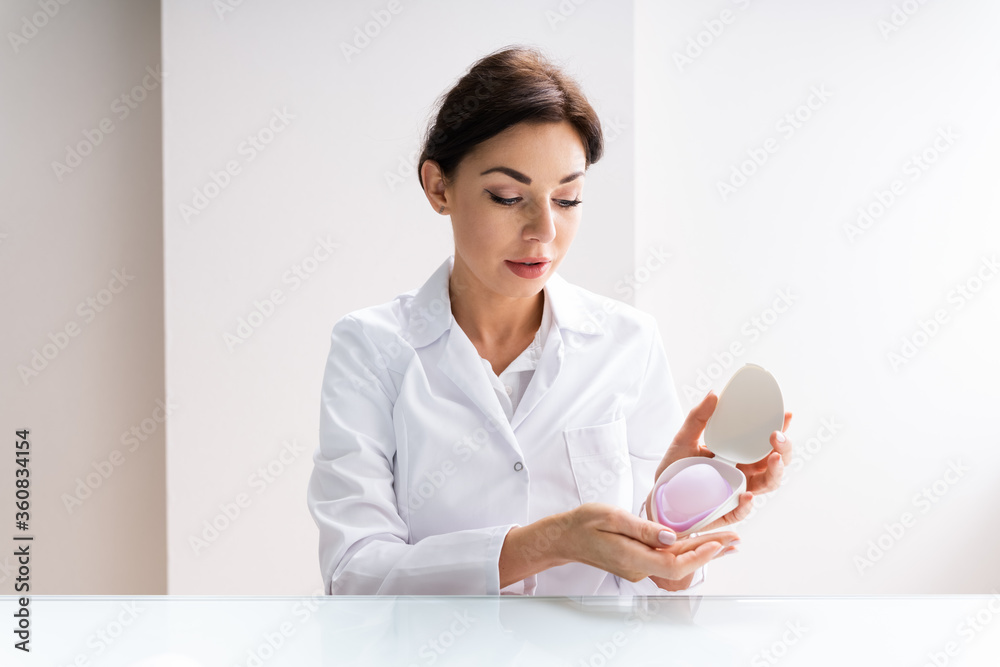 Gynecologist Doctor Explaining Contraceptive Diaphragm Gynecologist Doctor Explaining Contraceptive Diaphragm