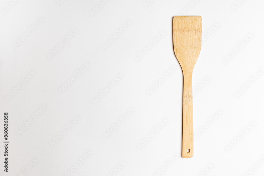 bamboo spatula for cooking on a white salted background. bamboo spatula for cooking on a white salted background.