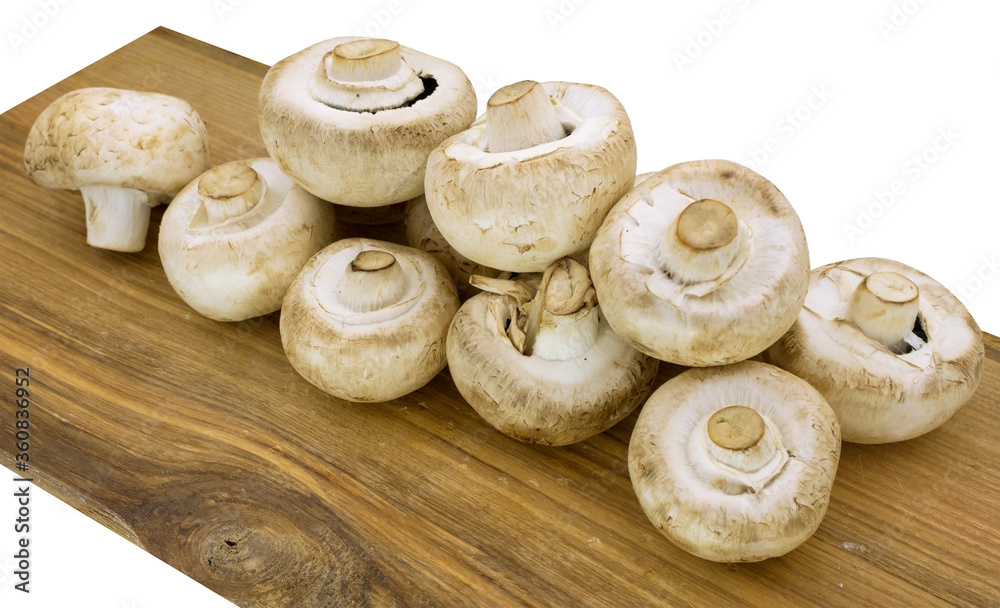 champignons on a wooden board on white