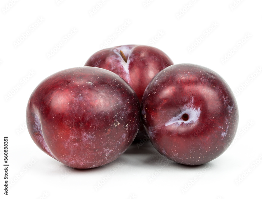plums on a white