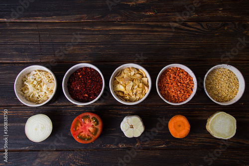 Bowls with dried and ground vegetables. Top view