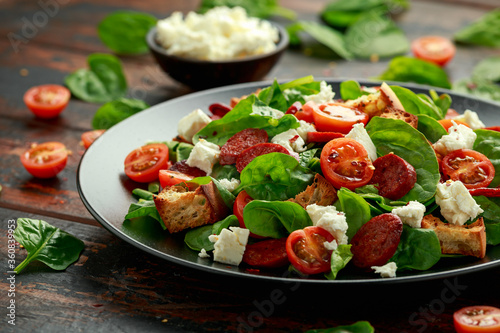 Chorizo Tomato salad with spinach, feta cheese and croutons. healthy summer food