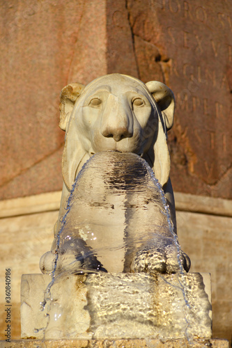 Marble Egyptian lion from Piazza del Popolo central fountain, erected in 1823, one of the most important and ancient square in Rome © crisfotolux