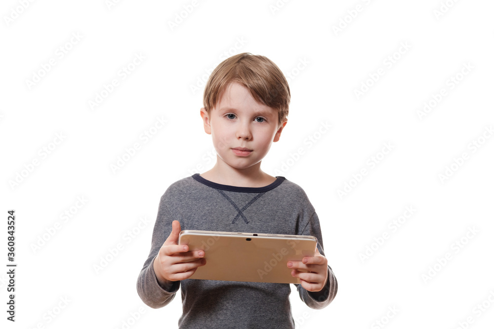 Cute boy with tablet computer looking confidently Cute boy with tablet computer looking confidently
