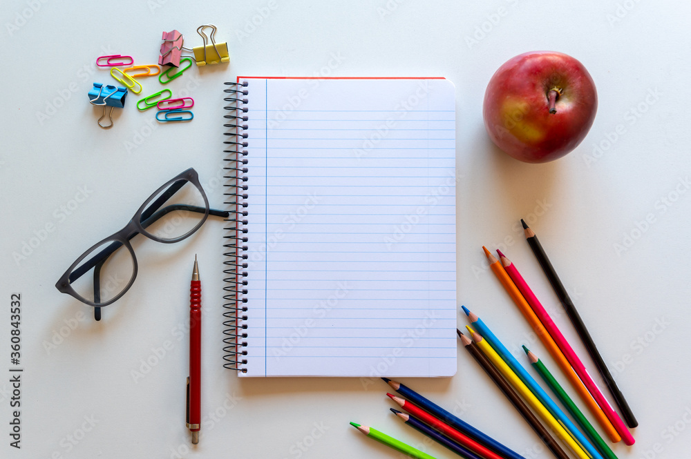 Back to school, desk with elements for the student's homework, overhead view Back to school, desk with elements for the student's homework, overhead view