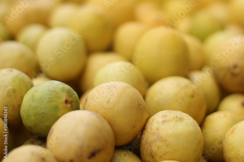 Lot of yellow lemons in a market