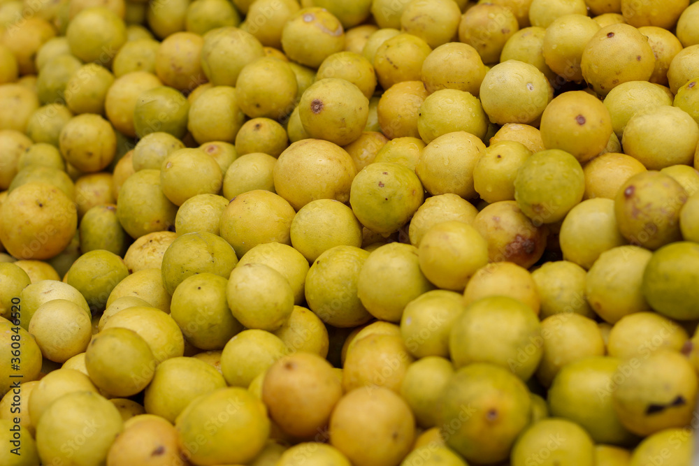 Lot of yellow lemons in a market
