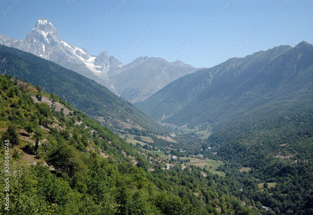 Summit of Ushba Mount and Enguri River Valley. Svaneti Region, Georgia, Caucasus.