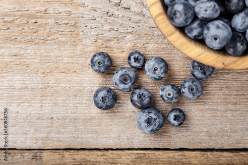 Freshly picked blueberries in wooden bowl. Blueberry antioxidant.