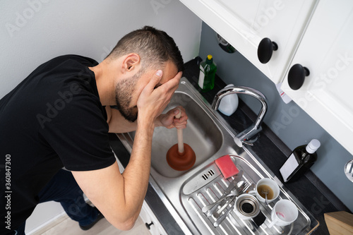 Quadro em tela Cleaning Blocked Drain Clog In Kitchen Sink