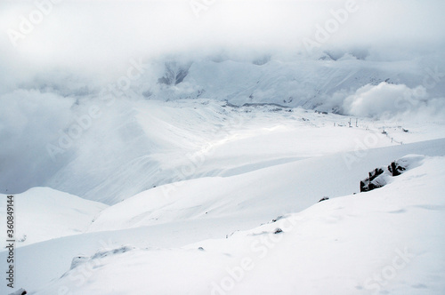 Cloudy winter mountainous landscape. The greater Caucasus mountain range. Gudauri ski resort. Georgia. © Kirill