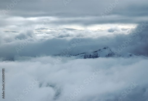 Cloudy winter mountainous landscape. The greater Caucasus mountain range. Gudauri ski resort. Georgia. © Kirill