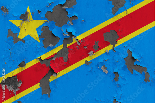Congo flag close up painted, damaged and dirty on wall peeling off paint to see concrete surface. Vintage National Concept.