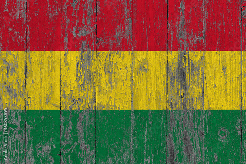 Bolivia flag on grunge scratched wooden surface. National vintage background. Old wooden table scratched flag surface.