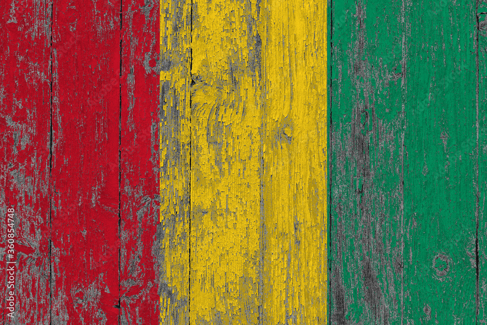 Guinea Bissau flag on grunge scratched wooden surface. National vintage background. Old wooden table scratched flag surface. Guinea Bissau flag on grunge scratched wooden surface. National vintage background. Old wooden table scratched flag surface.