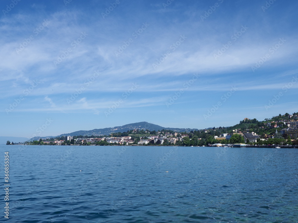 Scenic view of Lake Geneva and european Montreux city in canton Vaud in Switzerland, clear blue sky in 2017 warm sunny summer day on July.