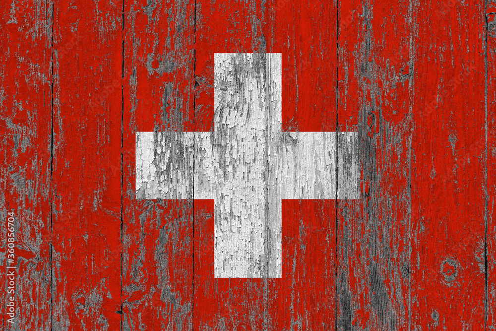Switzerland flag on grunge scratched wooden surface. National vintage background. Old wooden table scratched flag surface. Switzerland flag on grunge scratched wooden surface. National vintage background. Old wooden table scratched flag surface.