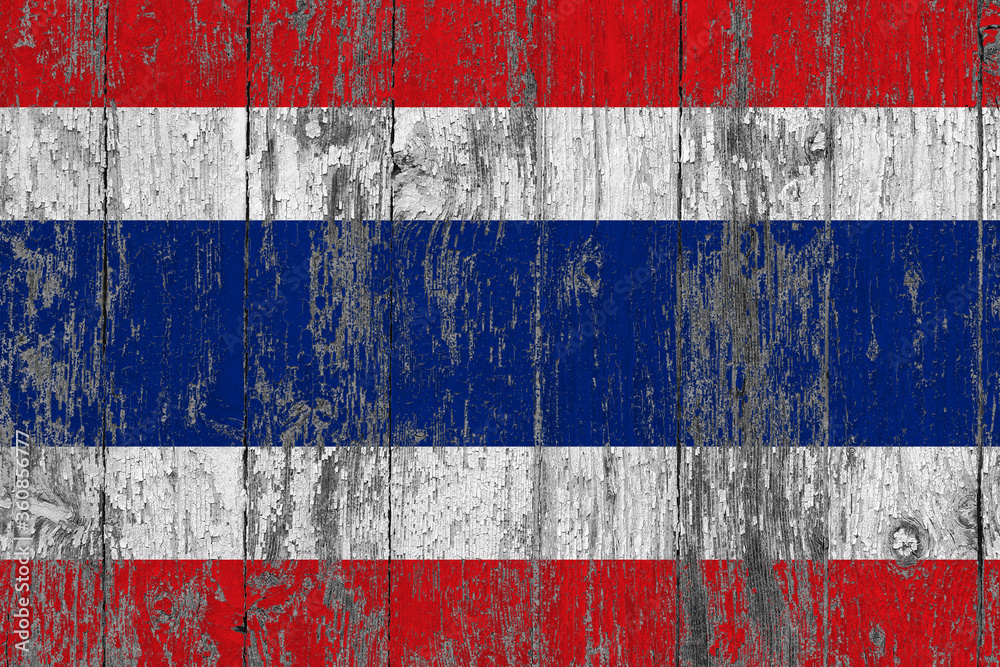Thailand flag on grunge scratched wooden surface. National vintage background. Old wooden table scratched flag surface.