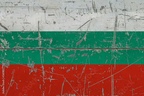 Bulgaria flag painted on cracked dirty surface. National pattern on vintage style surface. Scratched and weathered concept. © sezerozger